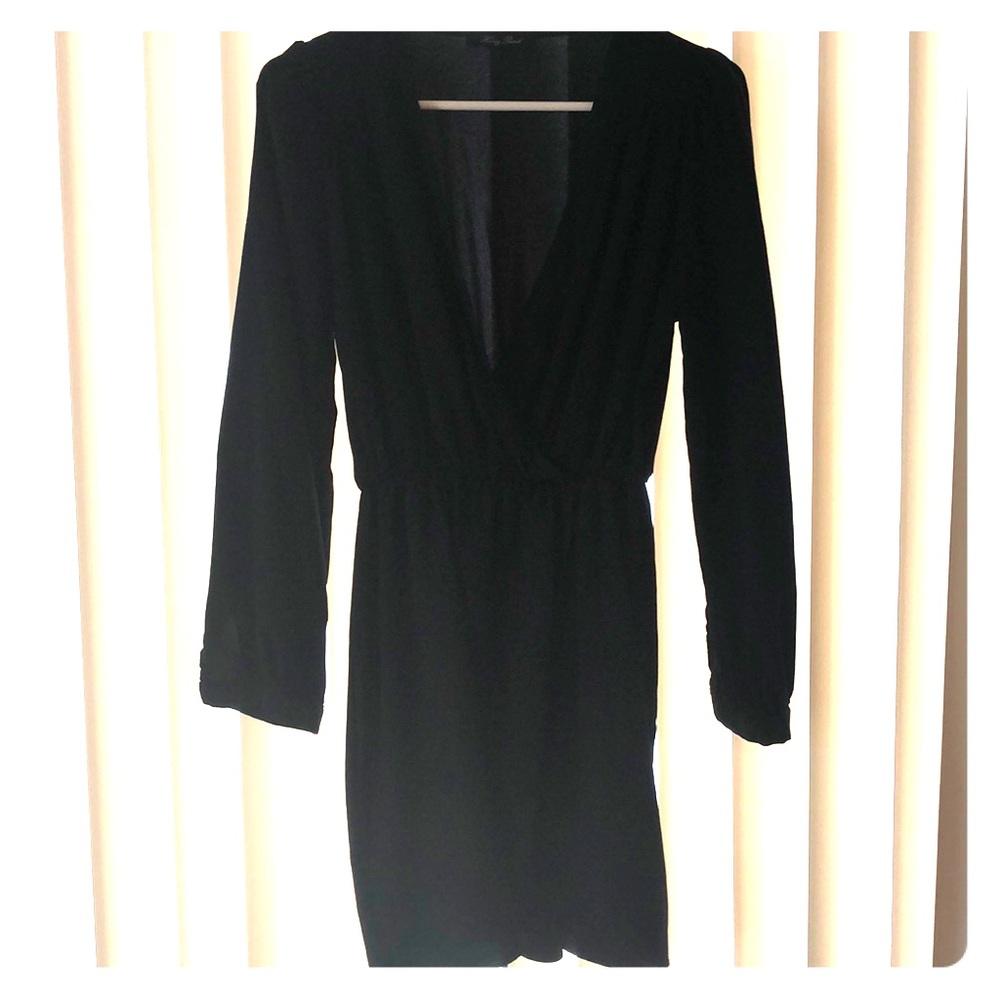 Short black long sleeve dress, low in the front.